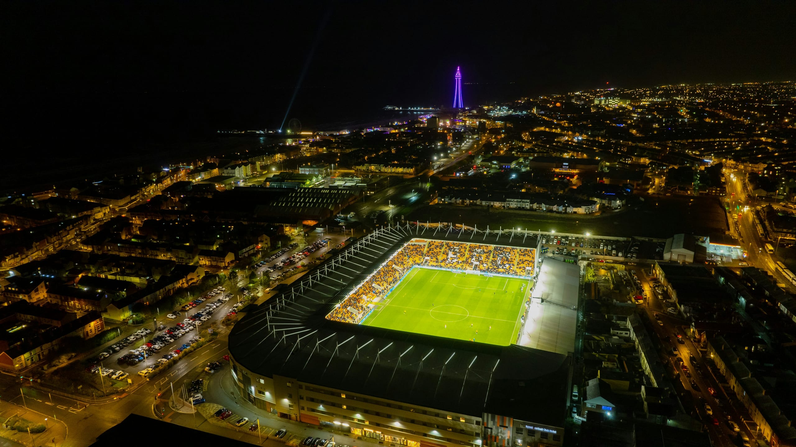 aerial view of a stadium lit at night